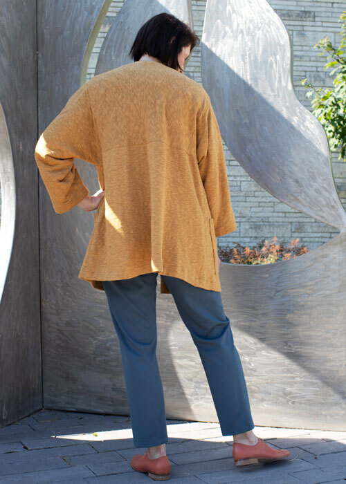 Back view of the long version of the Haiku Two Jacket worn with the Helix Pants and the Willow Blouse.