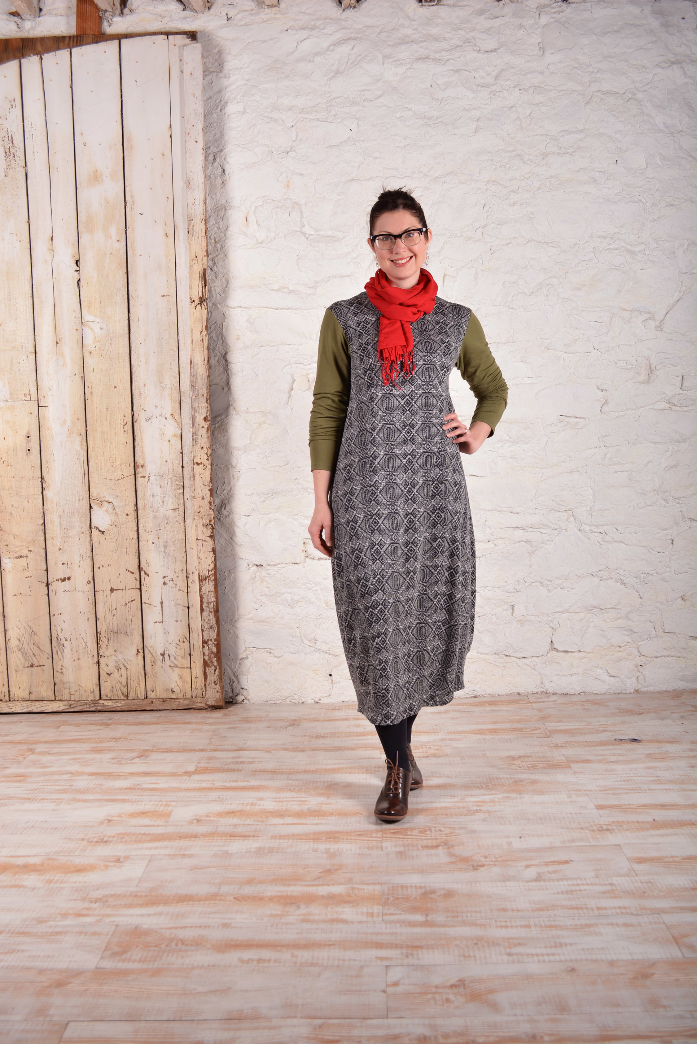 Cityscapes dress made out of a print knit fabric with contrasting sleeves.