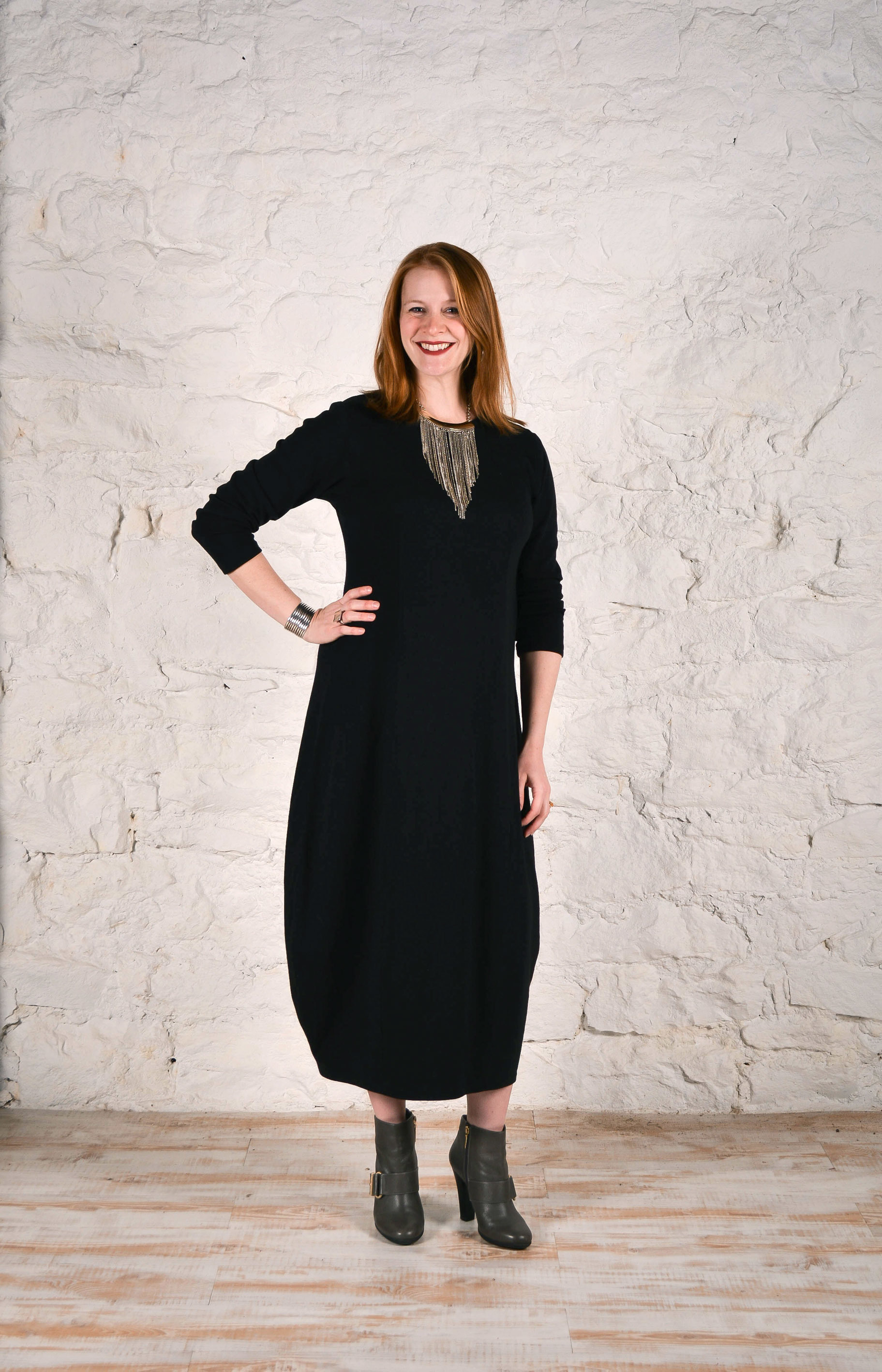 Cityscapes dress made in a black knit fabric.