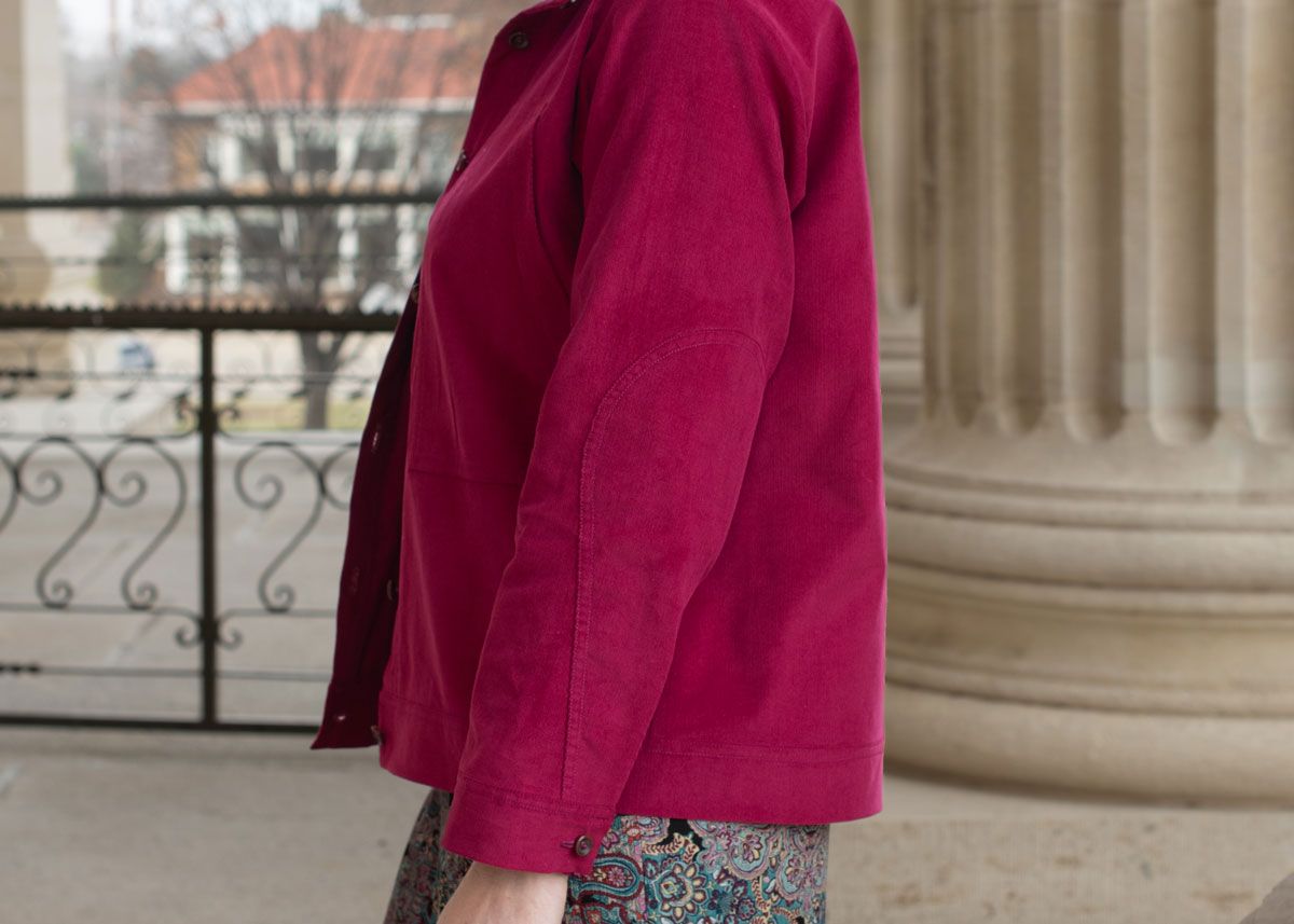 Side view of the Day Jacket made in raspberry corduroy fabric. Side view of the Day Jacket made in raspberry corduroy fabric.