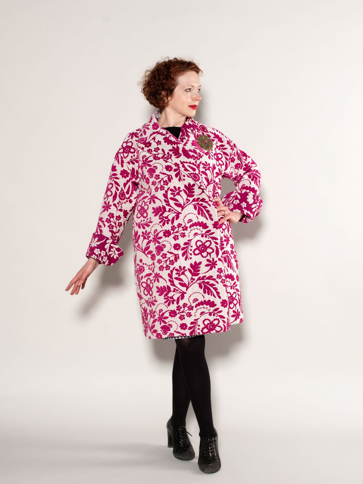 The Carnelian Coat in pink and white jacquard fabric. 