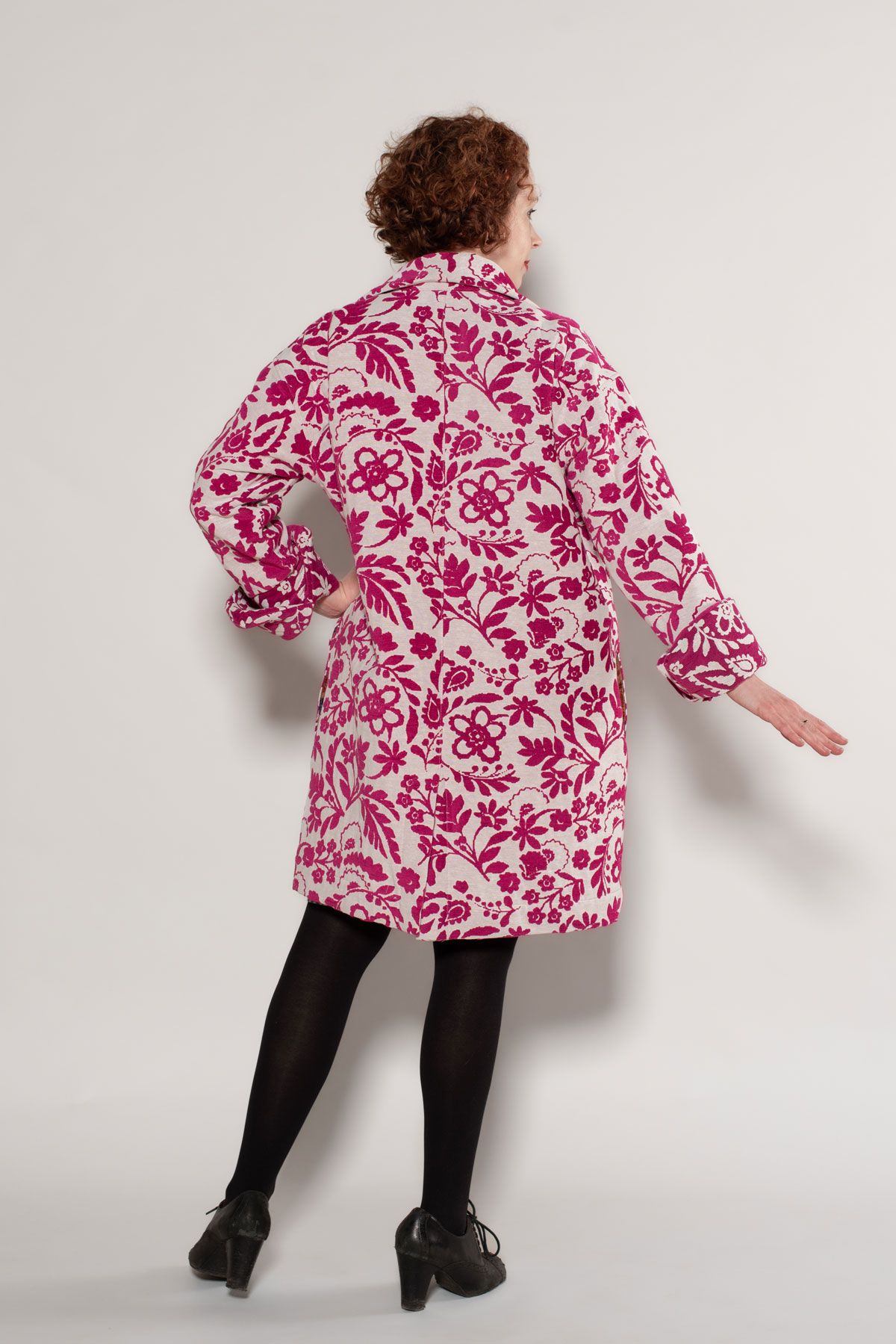 The Carnelian Coat in pink and white jacquard fabric. 