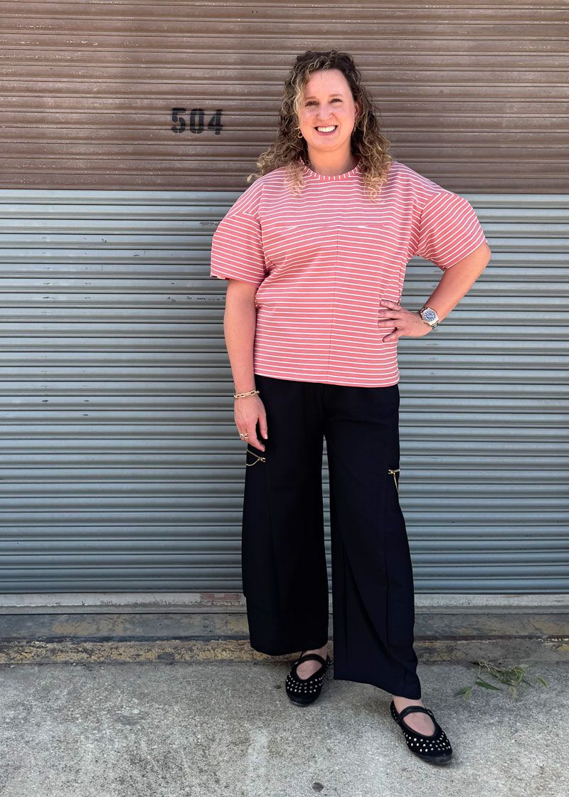 The Contour Top made in a striped Ponté knit fabric, worn with the Trio Pants. 