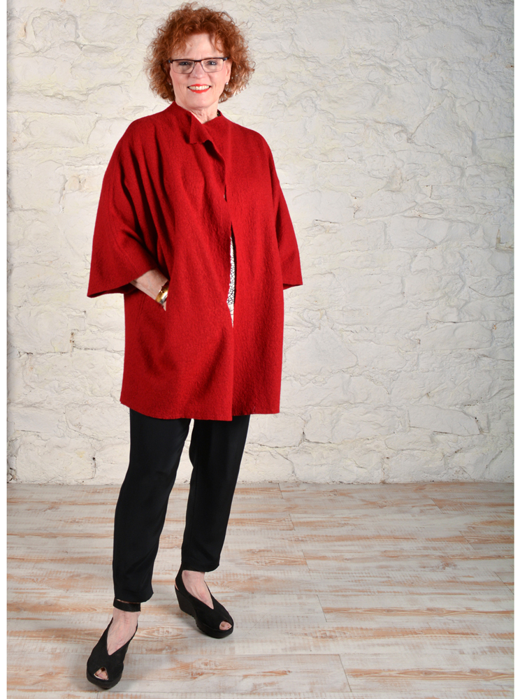 Chateau coat made in red wool boucle.