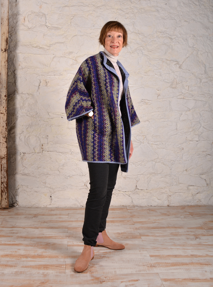 Chateau coat made in wool stripe fabric with knit binding.