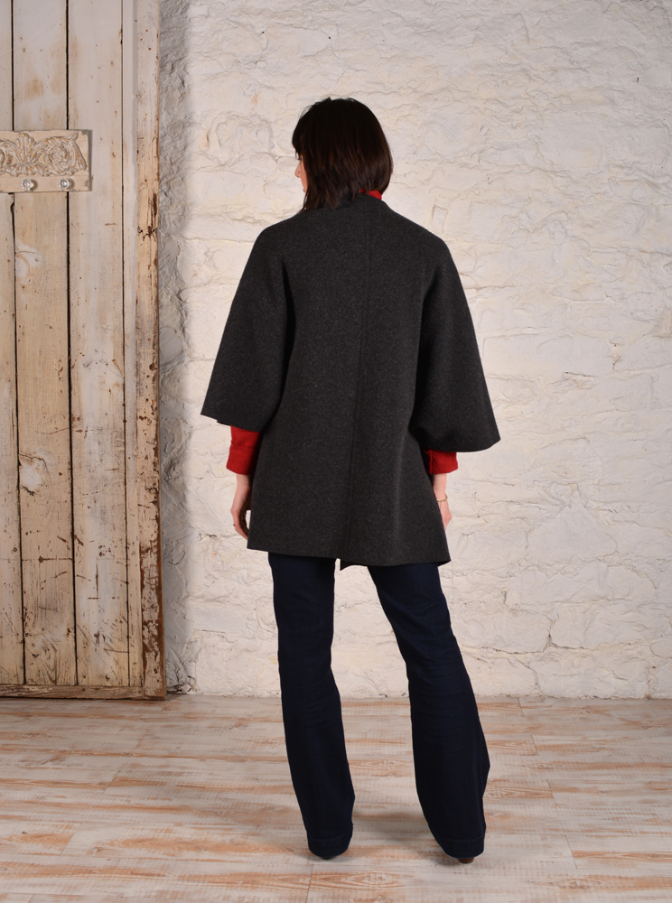 Back view of chateau coat made in charcoal grey boucle material