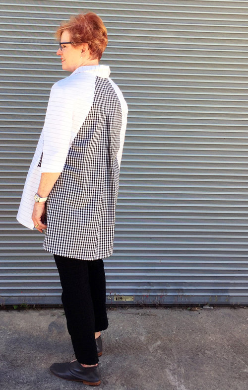 Back view the Frankie shirt made in a pinstripe shirting cotton, mixed with a gingham shirting cotton fabric. 