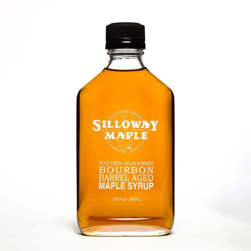 6.8 oz glass bottle of Bourbon Barrel aged maple syurp