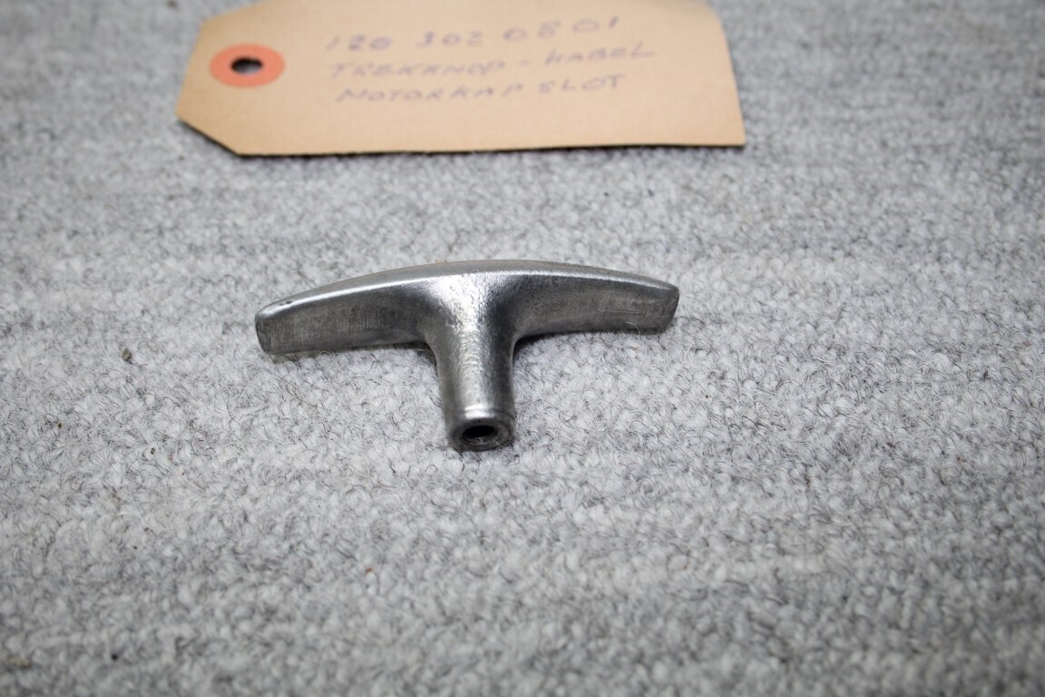 Trekknop motorkapslot