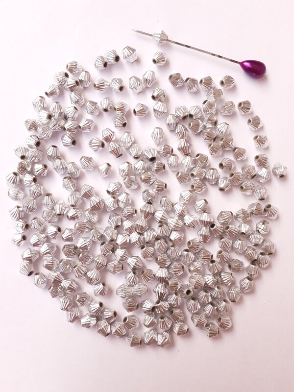 300 perles toupies argentées 3x4mm