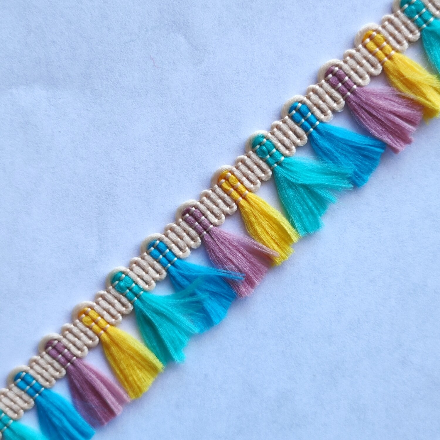 Galon pompon turquoise/jaune/vieux rose/bleu