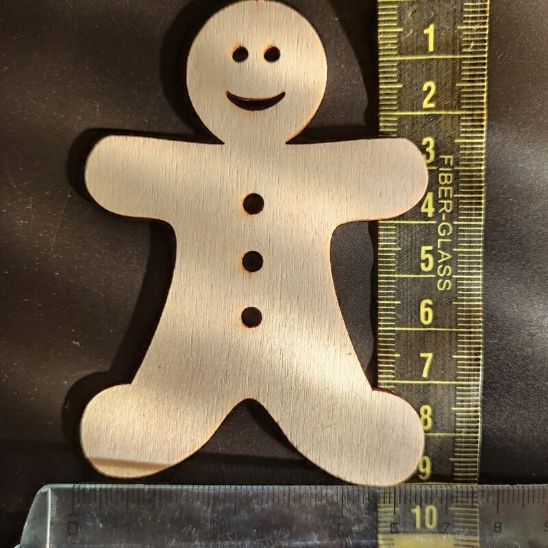 4 bonhommes en bois 9x6,5cm