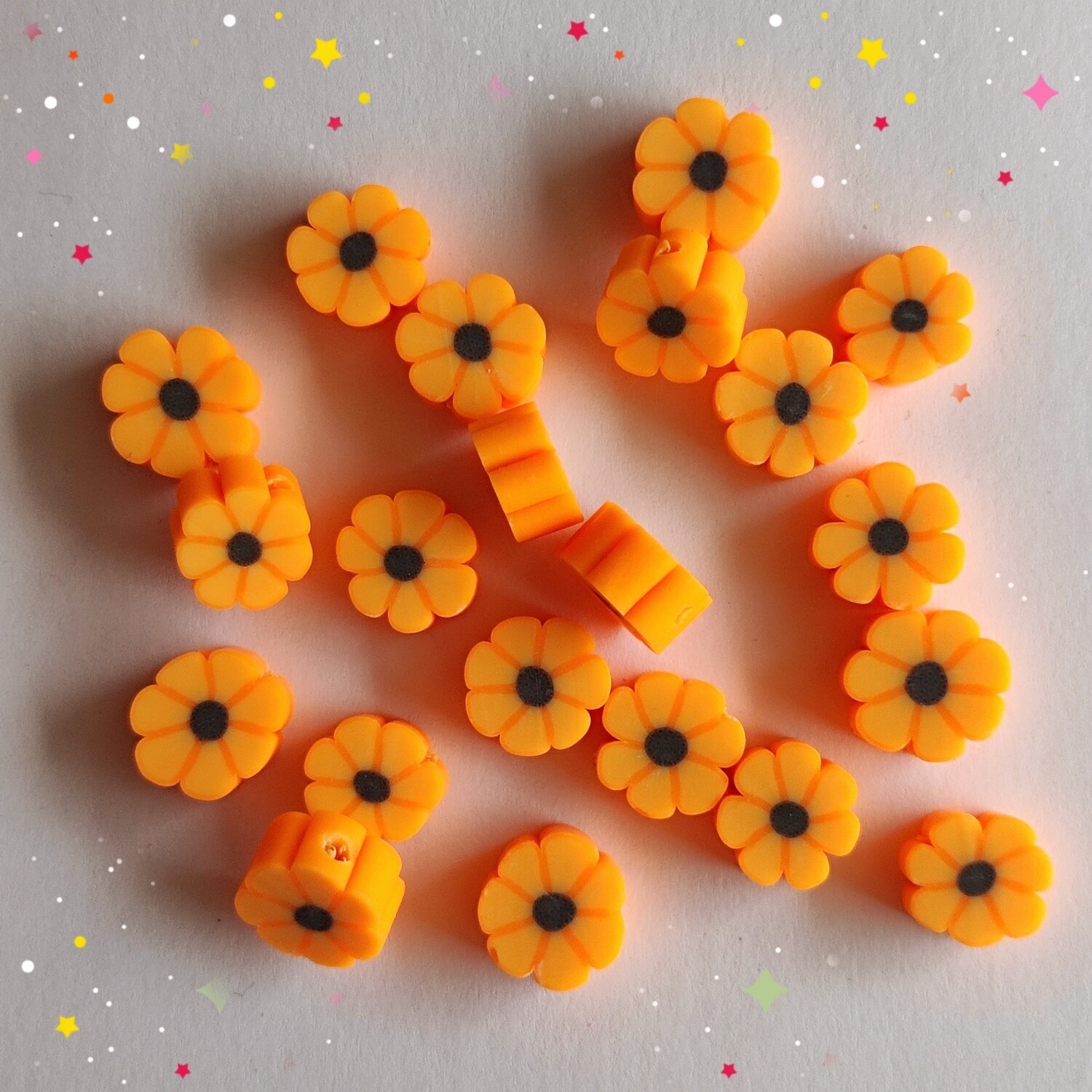 10 perles fleurs orange/noir 1cmx5mm
