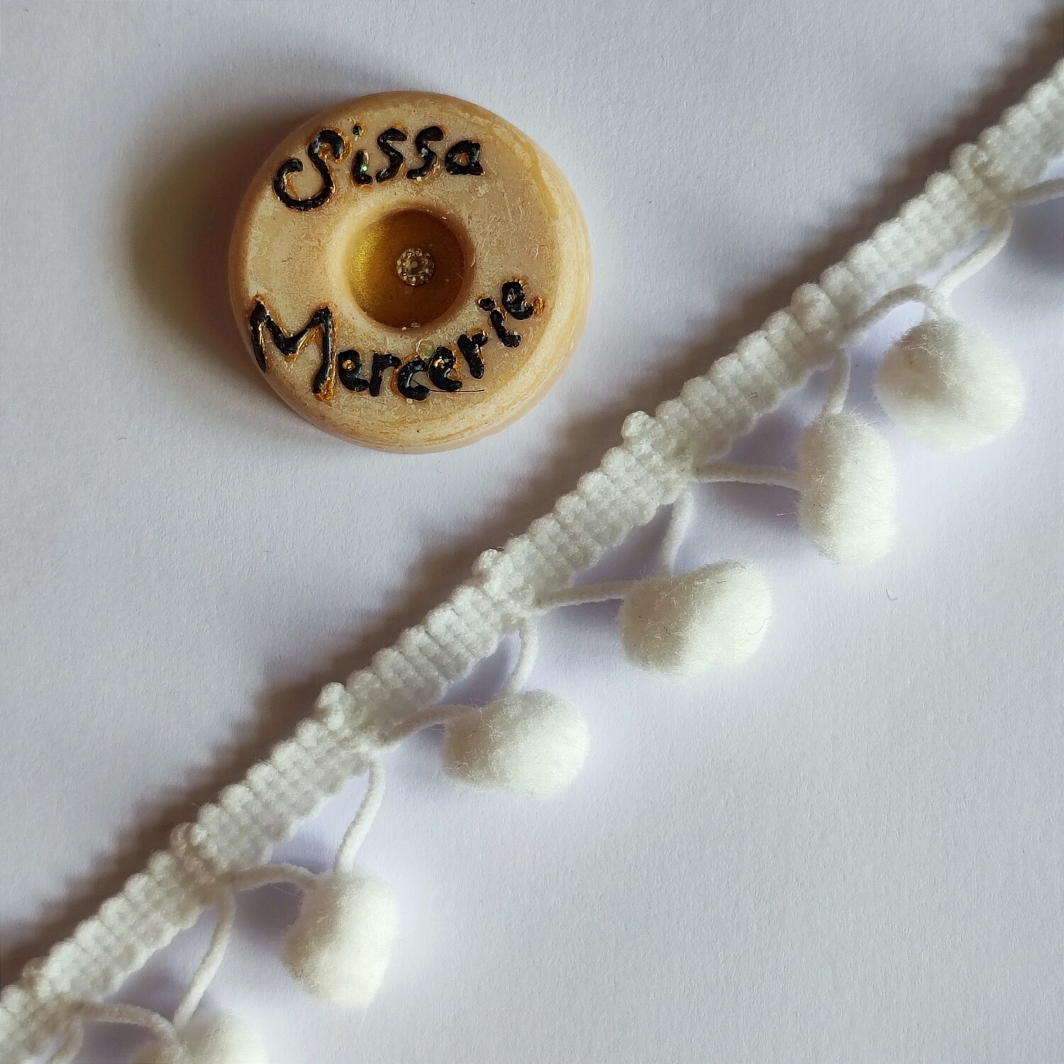 Galon pompon fil croisé au mètre 2,5cm (choisissez votre couleur)