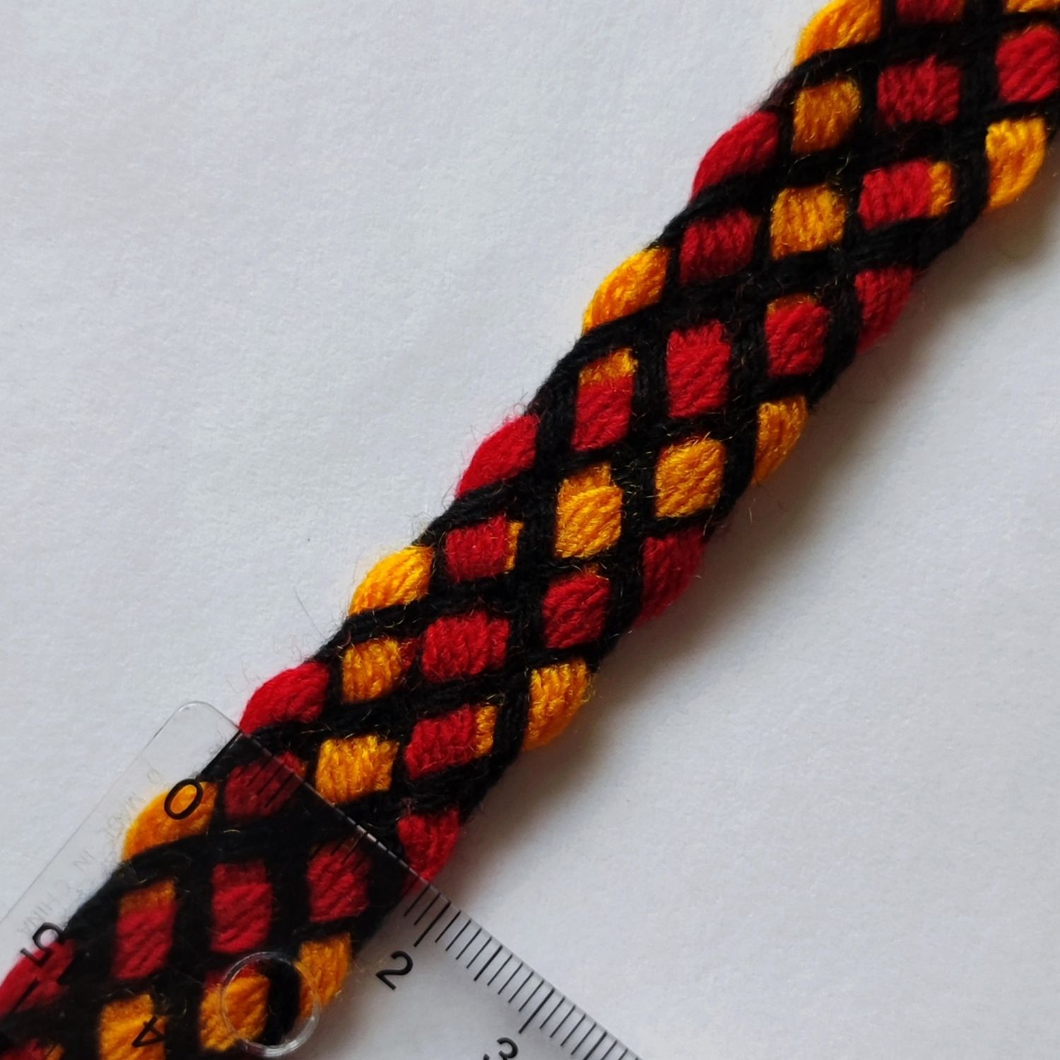 Galon tresse orange/rouge couture noire