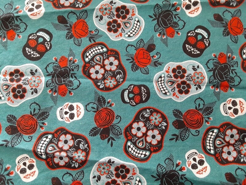 Sugar skulls on teal
