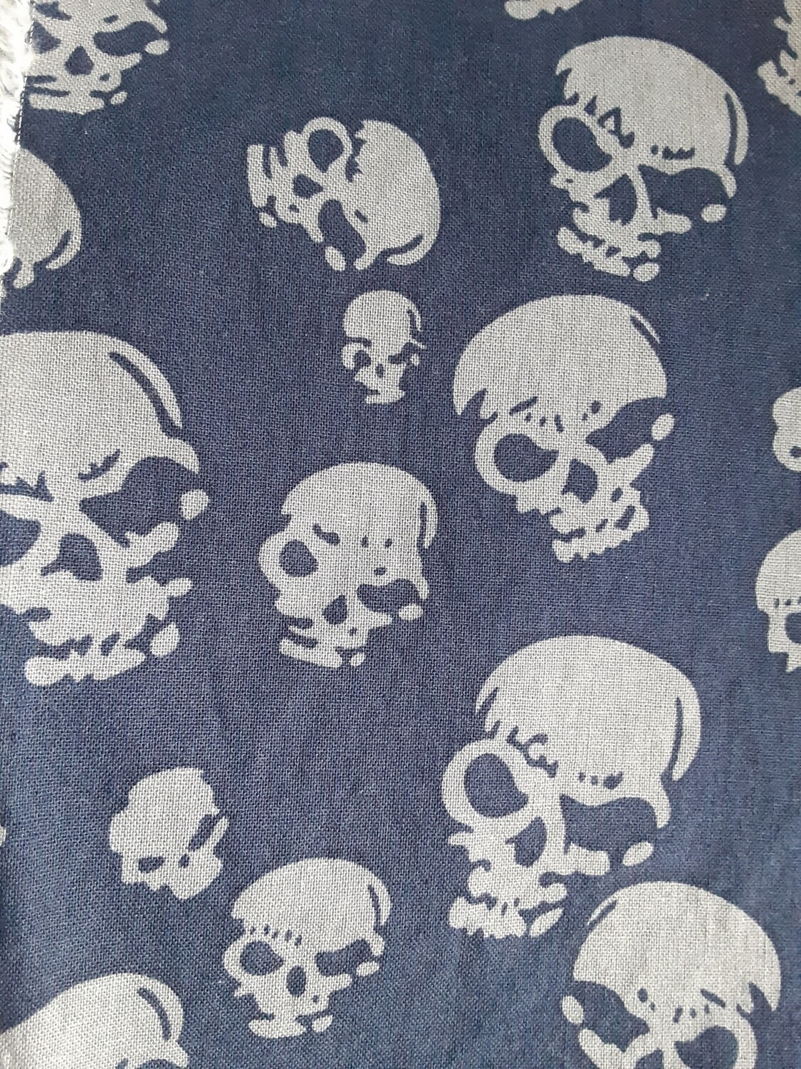 Stamped skulls on navy