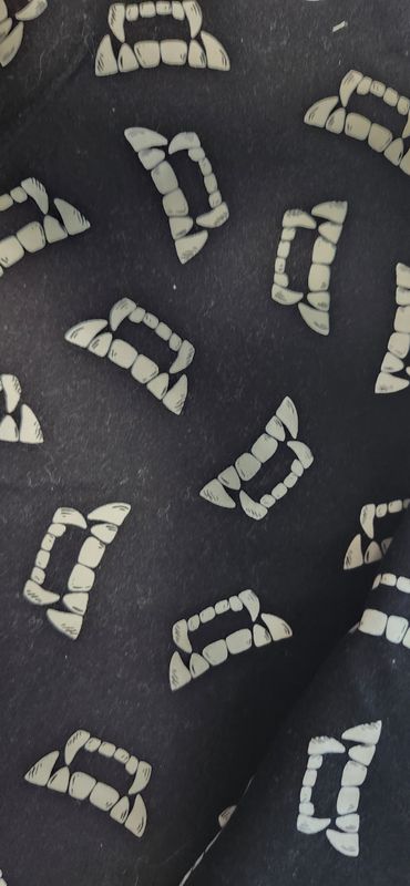 Glow in the dark vampire teeth