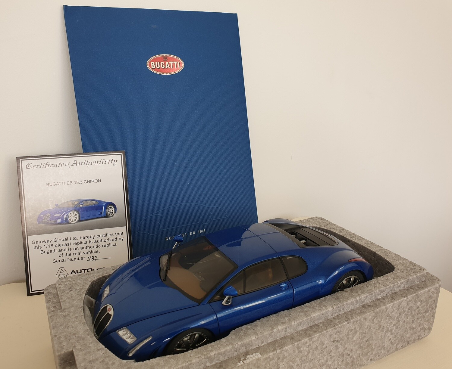 AutoArt 1/18 Bugatti 18.3 Chiron, actual car press kit, and Dauer EB110 model