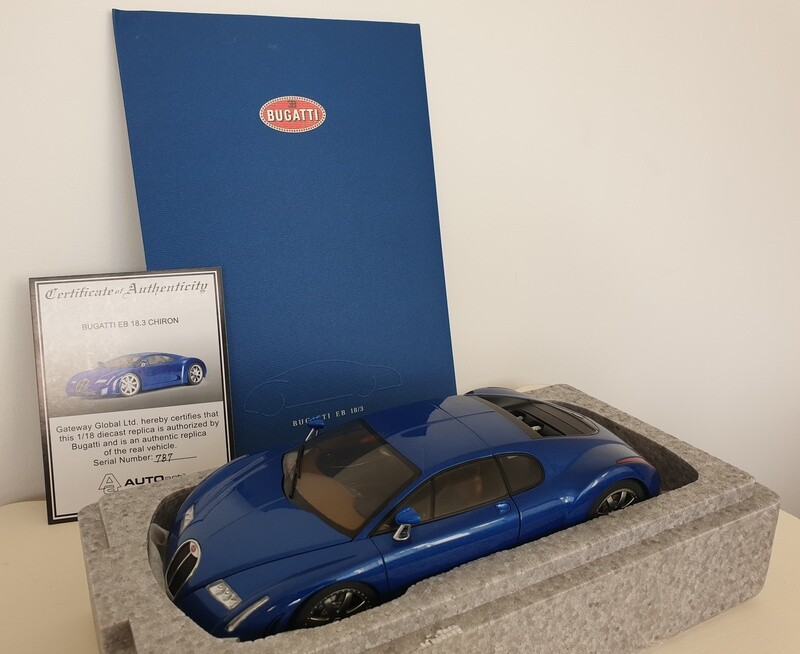 AutoArt 1/18 Bugatti 18.3 Chiron, actual car press kit, and Dauer EB110 model