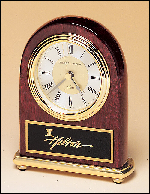 Rosewood Stained Piano Finish Clock on a Brass Base.