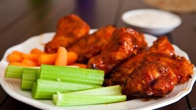 Barbecue Wings with Celery and Carrot Sticks and a side of Ranch