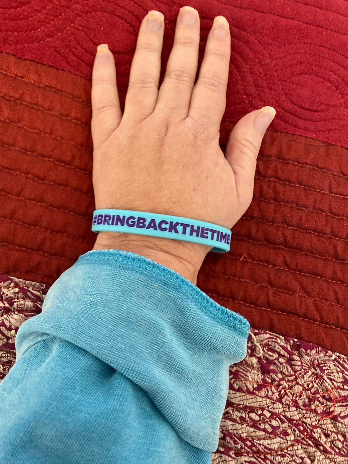  #BRINGBACKTHETIME Wristbands Turquoise Colour &amp; Purple Text