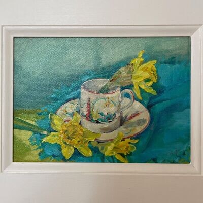 Daffodils and vintage coffee cup