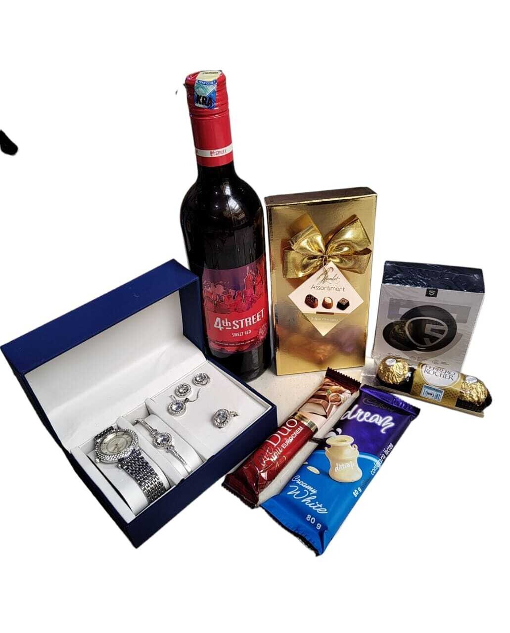 Esquisite gift package with assorted chocolates, ladies giftset, soundpeats earbuds & 4th street wine