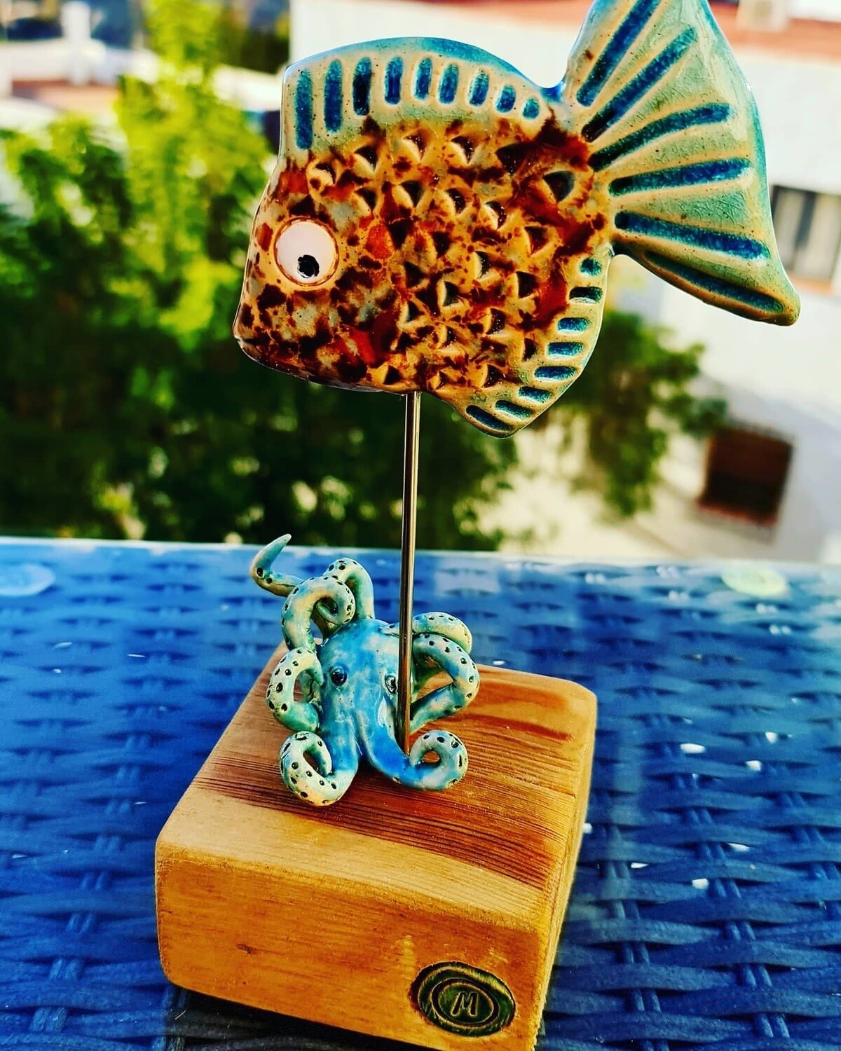 &#39;Friends&#39; sculpture Baby Octopus her Fish friend