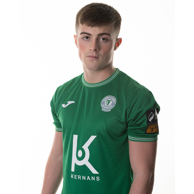 Finn Harps 2025 home jersey. Gavin Hodgins wears the green shirt which features contrasting design details on the collar and sleeves.