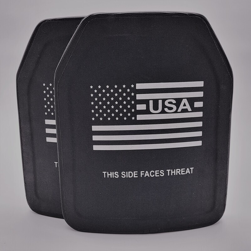 An oversized 11x14-inch Level IV ballistic armor plate designed to provide maximum protection against armor-piercing rifle rounds. The plate features a durable black exterior with a multi-curve shape for enhanced comfort and fit, ideal for larger body types. Clearly marked with &#39;THIS SIDE FACES THREAT&#39; and a white American flag graphic, this stand-alone plate is built for elite defense in high-threat tactical situations.