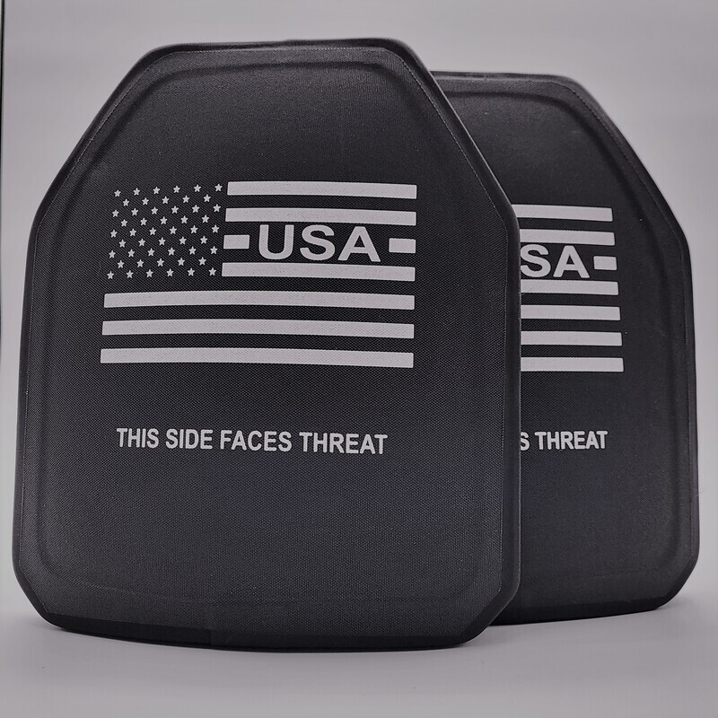 A black Level IV ballistic armor plate designed to stop armor-piercing rifle rounds, offering the highest level of personal protection. The plate features a sleek, multi-curve design for a comfortable fit, along with clearly marked text reading 'THIS SIDE FACES THREAT' and a white American flag graphic. Built for tactical professionals, law enforcement, and prepared civilians, this stand-alone plate delivers maximum stopping power in a lightweight, durable construction.
