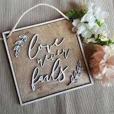 Love never fails wooden wall plaque