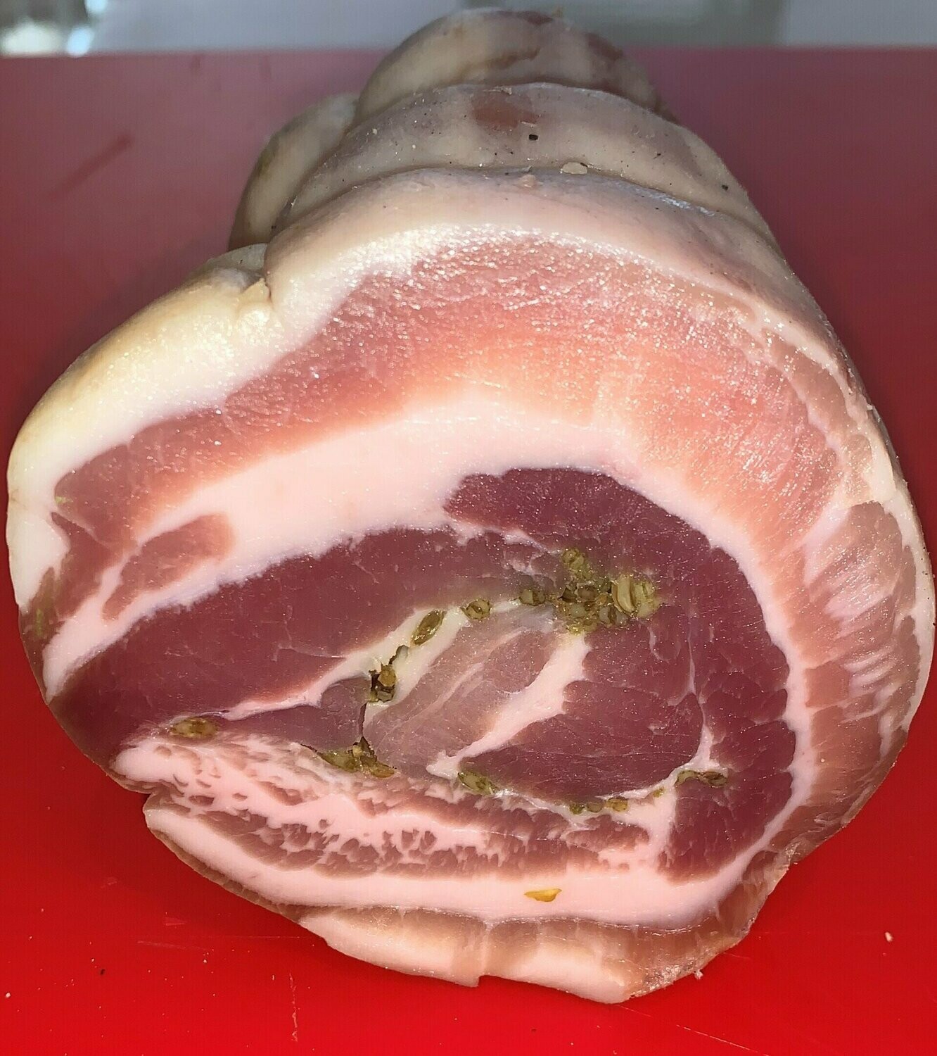 Pancetta arrotolata artigianale