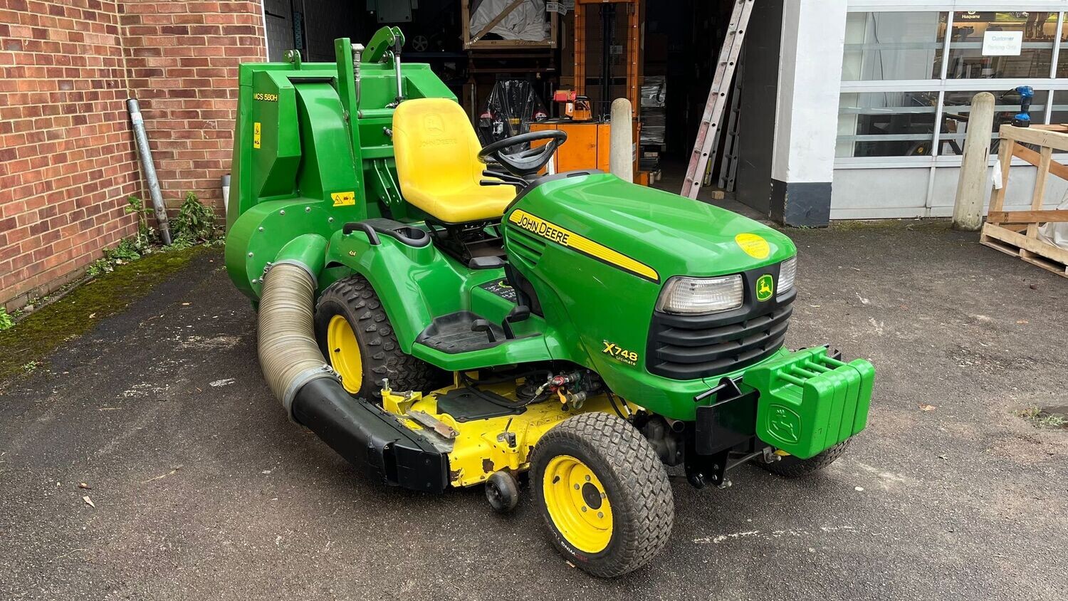 John Deere X748 Diesel Lawn Tractor with 54 Cutting deck and High dump Clam shell Grass