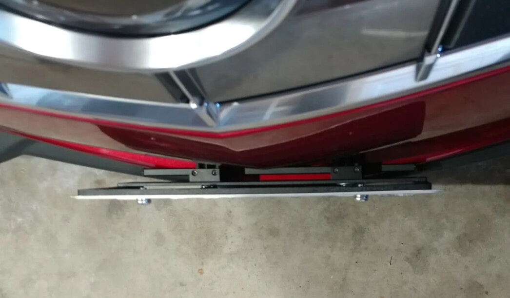 Sly Bracket for Cadillac with horizontal slat lower grille.