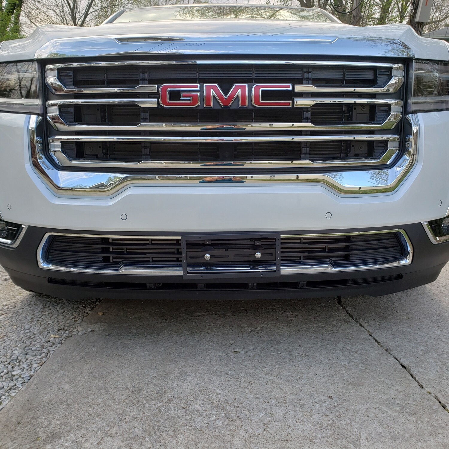 Sly Bracket for GMC models with mesh-style grille.
