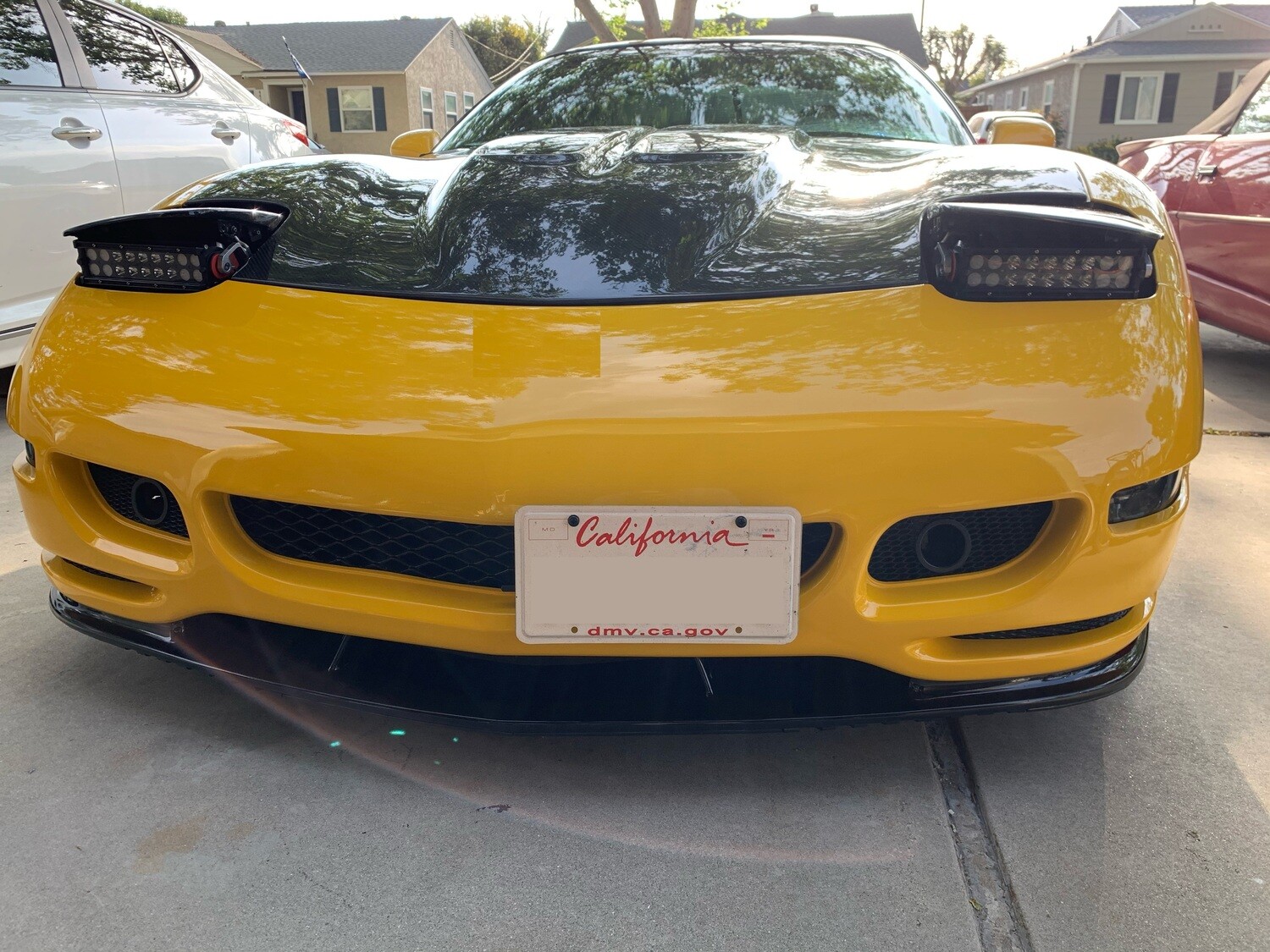 Sly Bracket for Chevrolet Corvette with mesh-style lower grille.