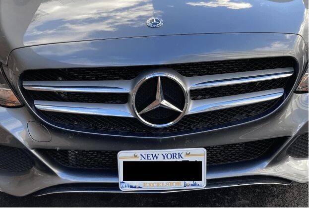 Sly Bracket for Mercedes-Benz models with mesh lower grille.