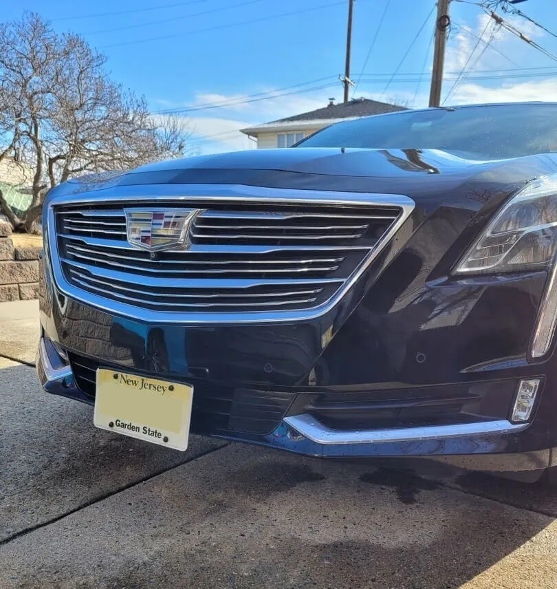 Sly Bracket for Cadillac with horizontal slat lower grille.