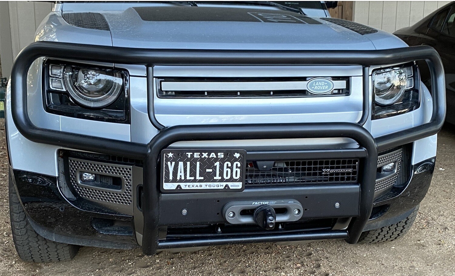 Sly Bracket for Land Rover Defender with mesh grille.