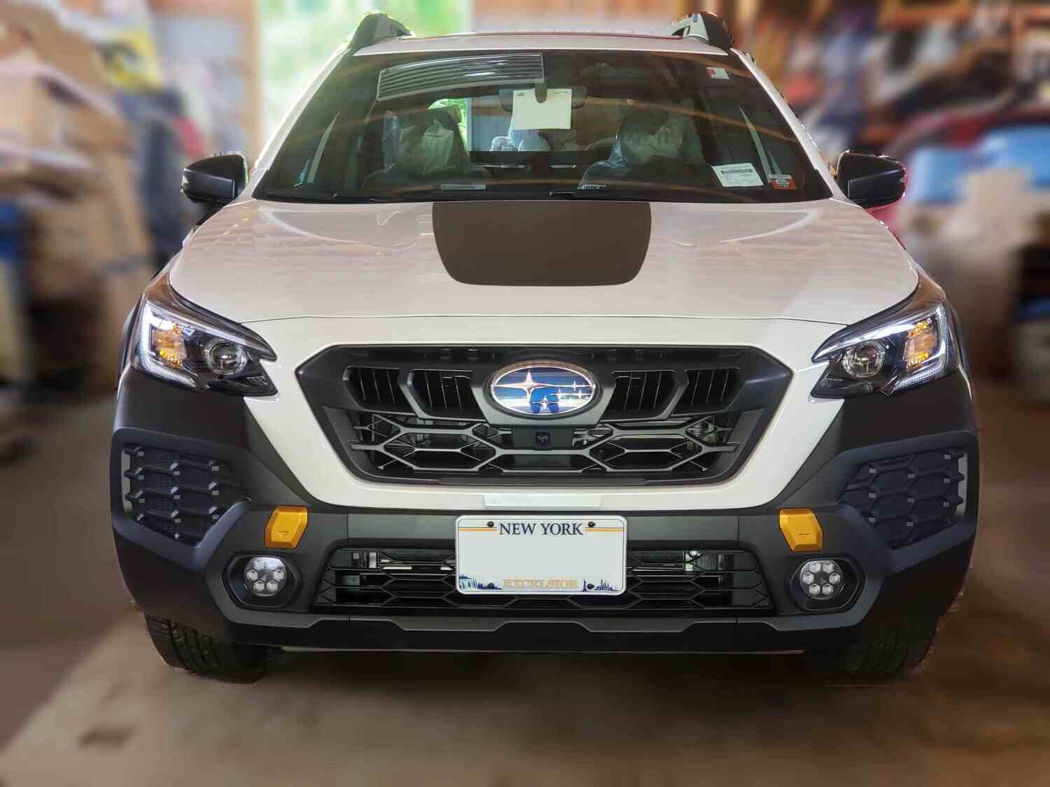 Sly Bracket for Subaru Outback Wilderness with mesh-style lower grille.