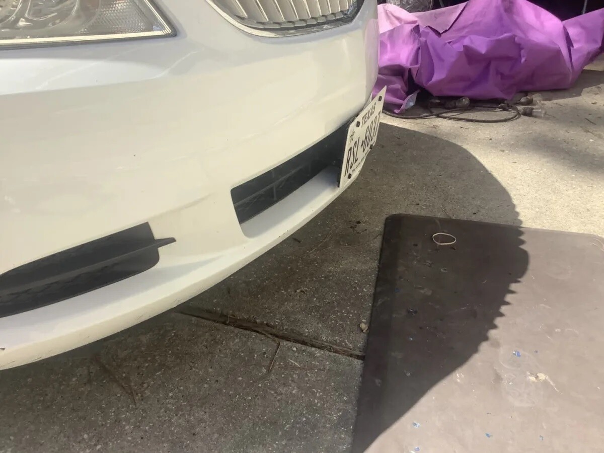 Sly Bracket for Buick Lacrosse with horizontal slats lower grille.