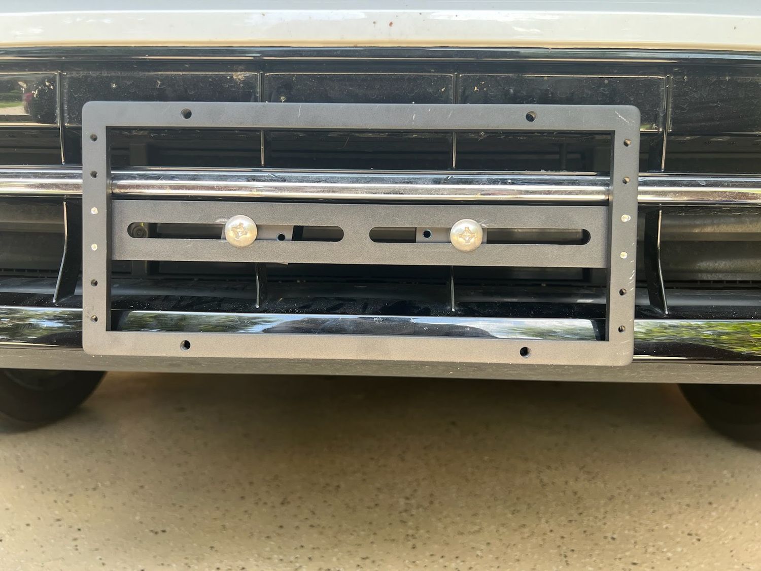 Sly Bracket for 2024-2025 Volkswagen Atlas with horizontal and vertical slats lower grille.