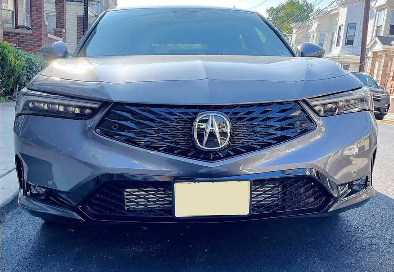 Sly Bracket for Acura Integra with a mesh-style lower grille.