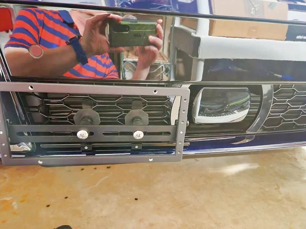 True no drill license plate bracket for BMW X6.  No drill No holes license plate holder mount bracket relocator.