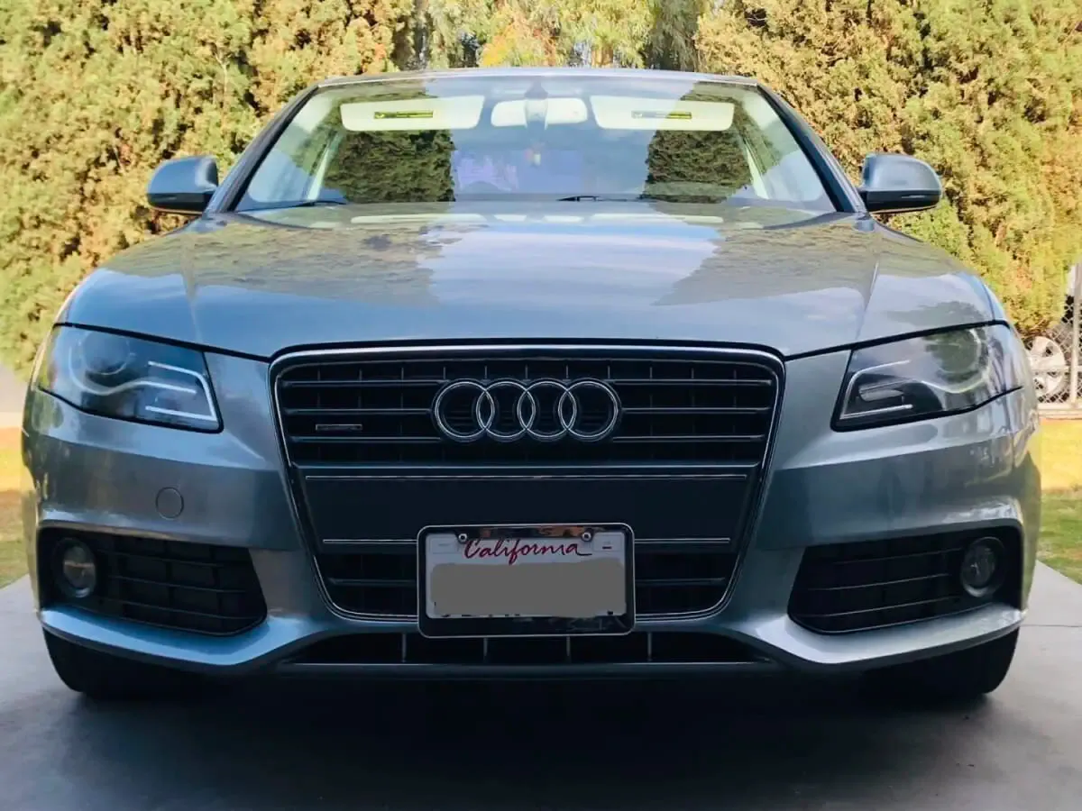 Audi A4 no-drill no-holes front license plate bracket holder mount frame relocator slats grille