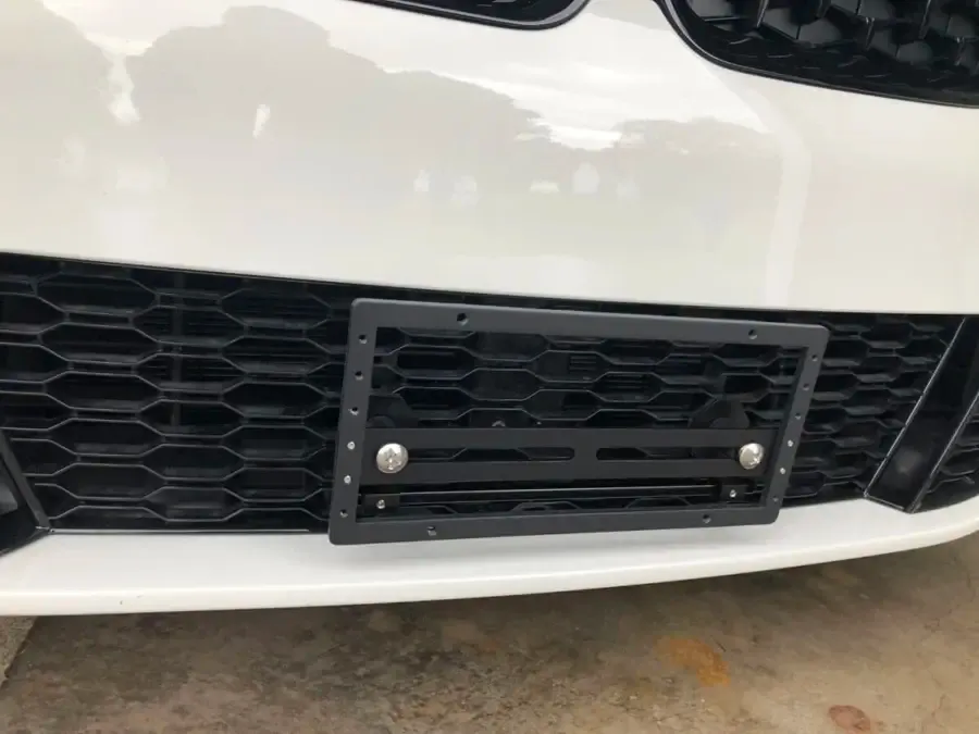True no drill license plate bracket for BMW M340i.  No drill No holes license plate holder mount bracket relocator.