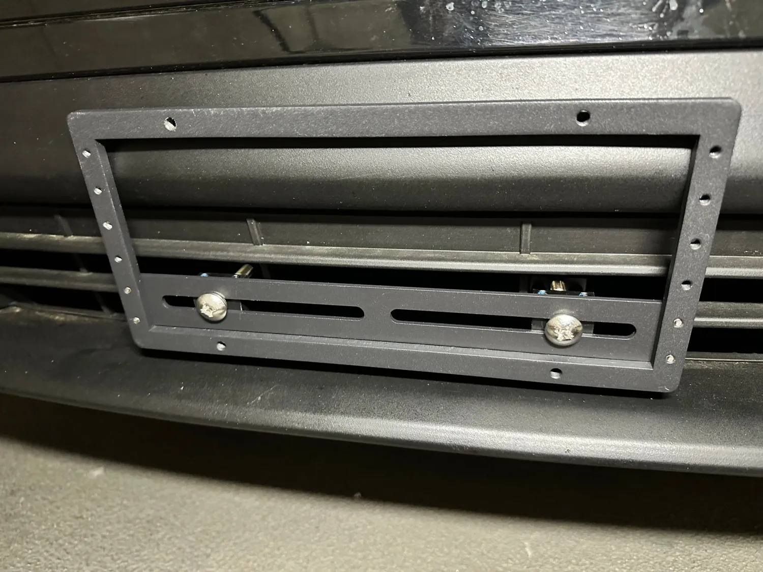 Sly Bracket fits 2014-2021 BMW i3 with horizontal slats lower grille.